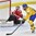 PLYMOUTH, MICHIGAN - April 1: Sweden's Hanna Olsson #26 scores the opening goal on Switzerland's Florence Schelling #41 during preliminary round action at the 2017 IIHF Ice Hockey Women's World Championship. (Photo by Minas Panagiotakis/HHOF-IIHF Images)